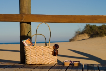 A handbag full with all basics for a relaxing day on the beachの写真素材
