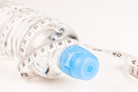 Water bottle and measuring band, a healthy lifestyle conceptの写真素材
