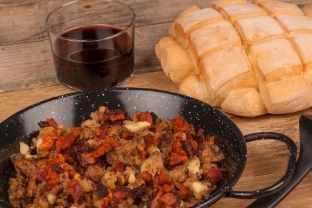 Red wine to enjoy a portion of traditional Spanish migasの写真素材