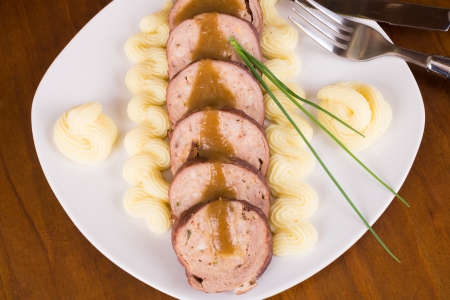 Portion of sliced paupiette served with a butter garnishの写真素材