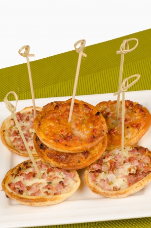 Portion of an assortment of small pizzasの写真素材