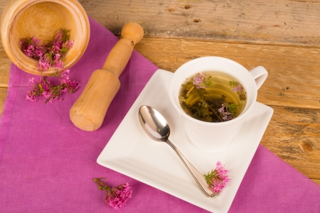 Still life  with a freshly prepared valerian teaの写真素材