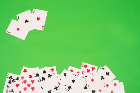 Poker cards on a traditional green backgroundの写真素材