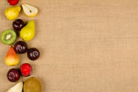 Assorted fresh fruit arranged in a backgroundの写真素材