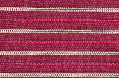 Striped red cotton fabric, a textile background