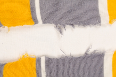 Full frame take of a ripped piece of fabric