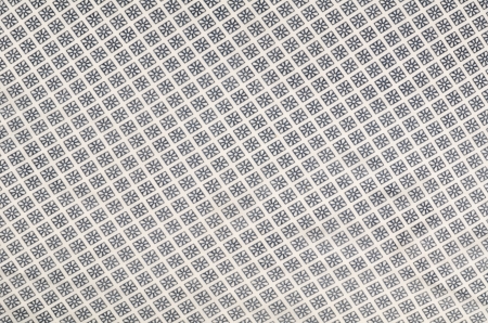 Full frame take of a patterned tablecloth in black and white