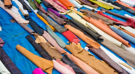 Multicolored leather scraps on a market stallの写真素材