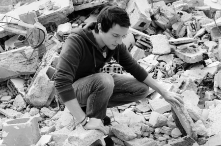 Black and white take depicting hard times among debrisの写真素材