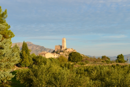 Old medieval castle ruin surrounded by Mediterranean landscapeの写真素材