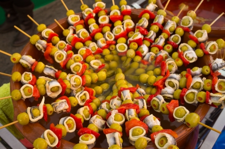 Skewered  stuffed olives with anchovies and peppers, a Spanish classicの写真素材