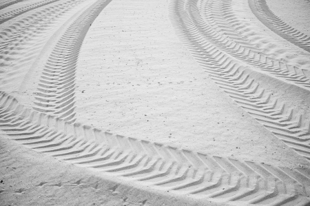 Intersected tyre tracks on soft sandy soilの写真素材