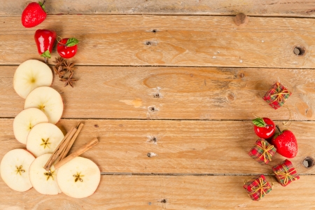 Sliced apples in a still life with cinnamon sticksの写真素材
