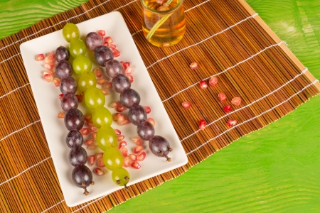 Grapes served as snakes, a kid dessert ideaの写真素材