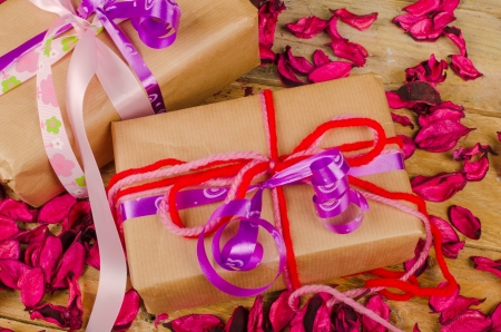 Fancy Valentines day gift boxes surrounded by dried flower petalsの写真素材