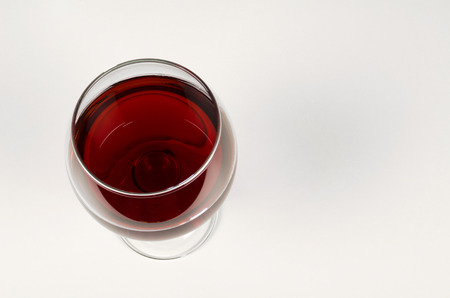 High angle viewpoint take of a glass of red winteの写真素材