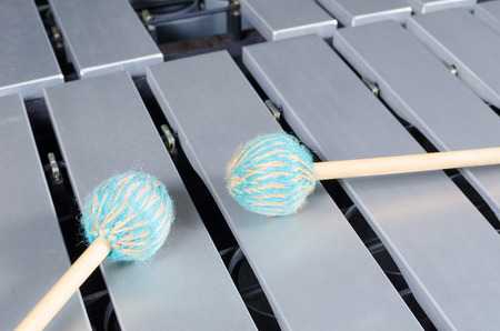 Silver keyboard of a vibraphone with mallets on top
