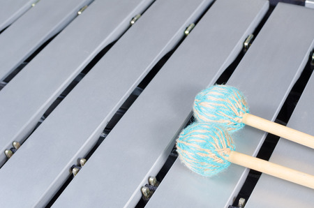 Silver keyboard of a vibraphone with mallets on top