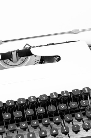 Old typewriter with paper on, ready for jounalistic action, a conceptの写真素材