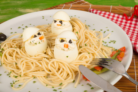A funny pasta dish looking like birds in a nest, kid food