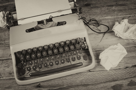 Rumpled paper around a typewriter, a concept for  a creativity blockの写真素材