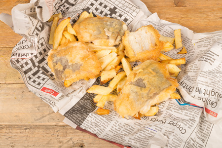 Fish and chips on their traditional newspaper wrapの写真素材