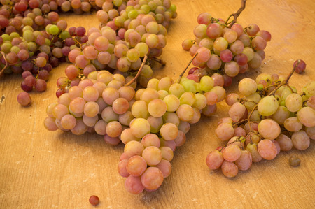 Bunches of grapes on display at a street market stall