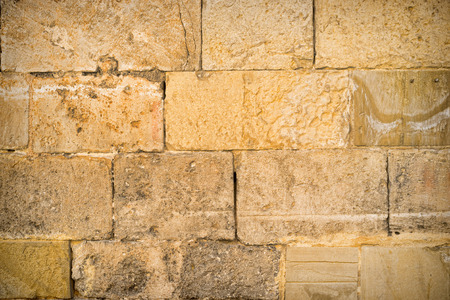 Full frame take of an old stone wallの写真素材