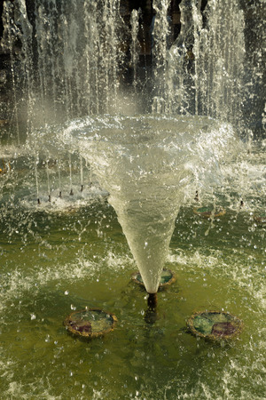 Closeuup of the splashing water of a fountainの写真素材