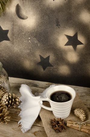Cup of  a hot drink in a Christmas arrangementの写真素材