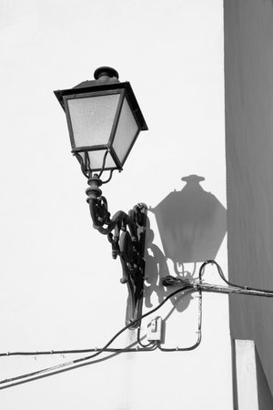 Whitewashed facade with street lamp,  traditional Mediterranean architectureの写真素材