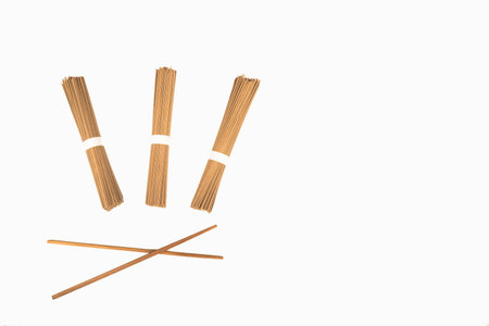 Traditional Japanese soba noodles and chopsticks on whiteの写真素材