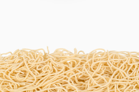Uncooked Chow Mein noodles on white with copy spaceの写真素材
