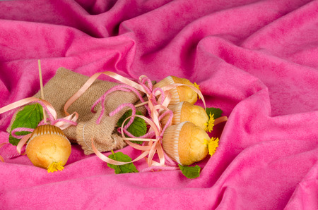 Freshly baked muffins displayed with a fancy decorationの写真素材