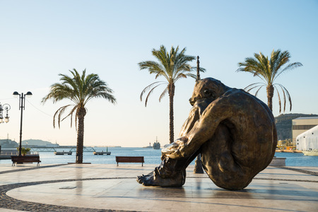 CARTAGENA, SPAIN - FEBRUARY 9, 2015: El Zulo statue by Victor Ochoa in Cartagena harbor.The statue is a tribute to victims of terrorism, in particular the ones of the 2003 Madrid train bombings. It shows a man in the attitude of a hostageのeditorial素材