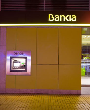 MADRID, SPAIN - FEBRUARY 24, 2015: A Bankia branch. Bankia was the result of a merger of several failed savings banks and has been in the eye of several political scandals since.のeditorial素材