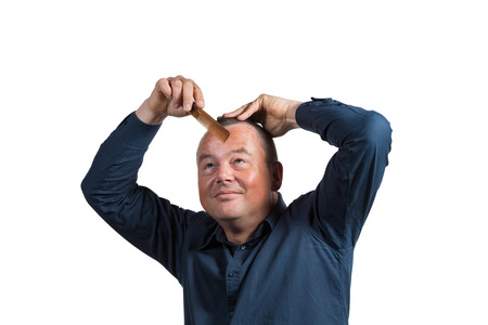 Guy starting to get worried about his little left hairの写真素材