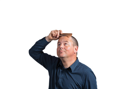 Guy starting to get worried about his little left hairの写真素材
