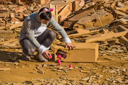 Easter Bunny hiding eggs inside an industrial ruin, a conceptの写真素材