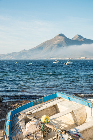 Traditional fishing tackle inside old boat on an Andalusian shoreの写真素材