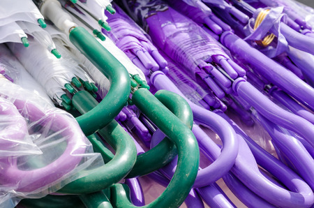 Assorted plastic umbrellas  on a street market stall