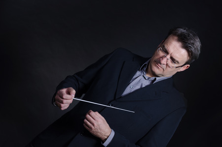 Portrait of a conductor using his batonの写真素材