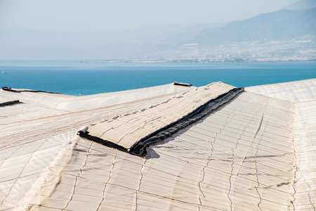 Landscape completely covered by the plastic of agricultural greenhousesの写真素材