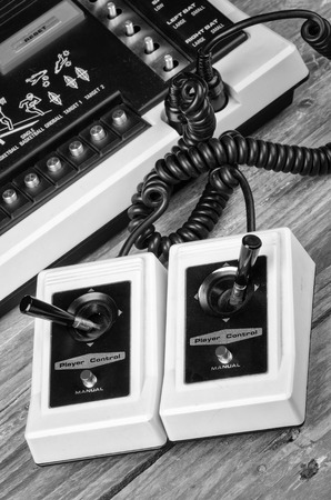Old game console with very simple wired joysiticksの写真素材