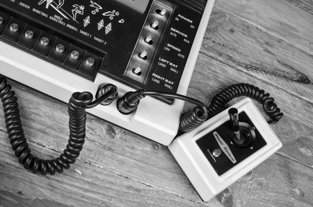 Old game console with very simple wired joysiticks