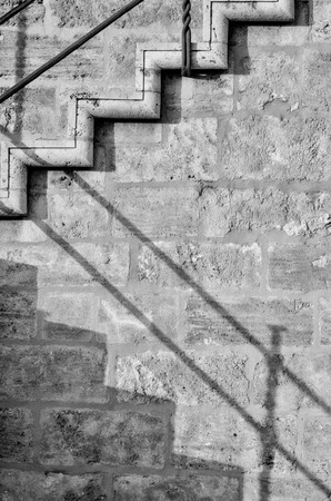 Abstract take of a staircase on an old stone wallの写真素材