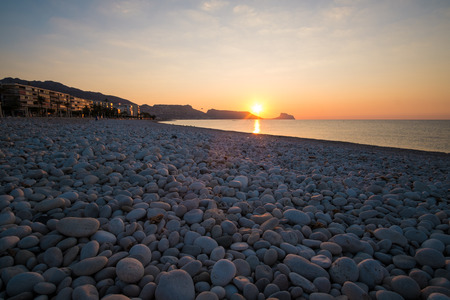 Sunrise on the calm waters of Altea bay, Costa Blanca, Spainの写真素材