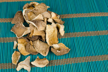 Dehydrated oyster mushrooms on a traditional bamboo matの写真素材
