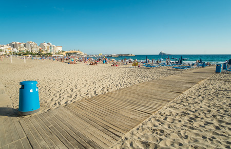 BENIDORM, SPAIN -SEPTEMBER 30, 2015: Early autumn on Benidorm beach. Benidorm is the largest tourist resort in Spain and a major player in Europe as a beach destinationのeditorial素材