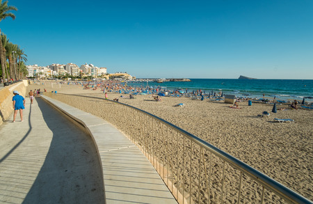 BENIDORM, SPAIN -SEPTEMBER 30, 2015: Early autumn on Benidorm beach. Benidorm is the largest tourist resort in Spain and a major player in Europe as a beach destinationのeditorial素材
